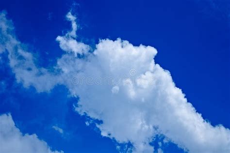 Puffy White Clouds In The Blue Sky Background Stock Photo Image Of