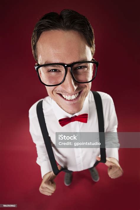 Portrait Of Nerdy Man Wearing Red Bow Tie And Suspenders Stock Photo
