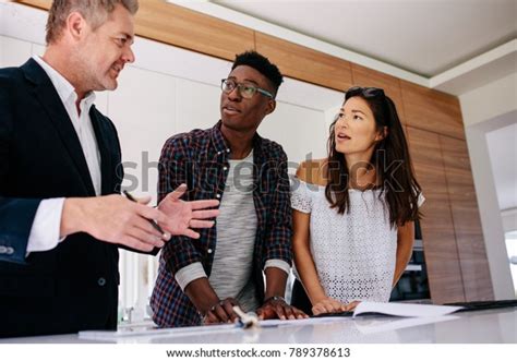 Interracial Couple Having Consultation Real Estate Stock Photo Edit Now