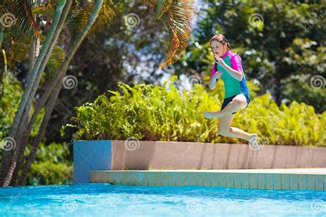 Kids Jump Into Swimming Pool Summer Water Fun Stock Image Image Of