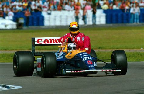 Nigel Mansell Gives Ayrton Senna A Lift After He Had Run Out Of Fuel At