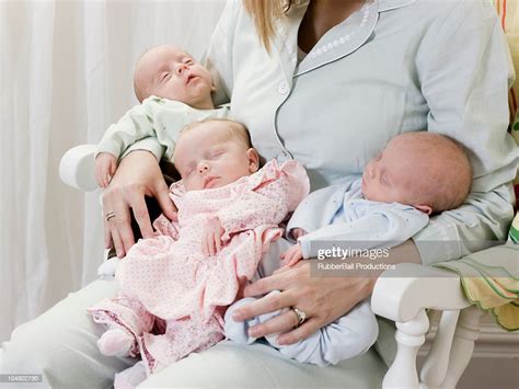 Mother With Newborn Triplets High Res Stock Photo Getty Images