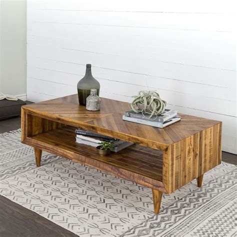 Rounding out the design, its open base features asymmetrical trestle framework for an architectural design. Alexa Reclaimed Wood Coffee Table | west elm