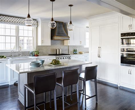 Cherry cabinets with a rich reddish stain and back of island a soft dark color. Kitchen Remodeling | Kitchen Village