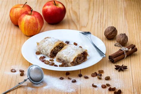 Apple Roll Pie With Cinnamon Walnuts And Raisins In A Plate On A