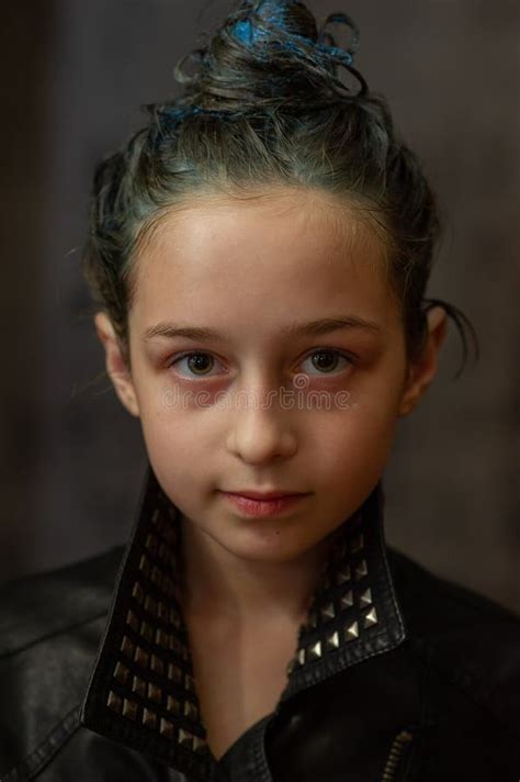 Portrait Of Nine Year Old Girl Teenager With Blue Strands On Her Hair