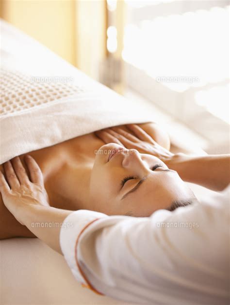 Woman Lying On Massage Table Receiving Shoulder Massage At A Luxury Spa