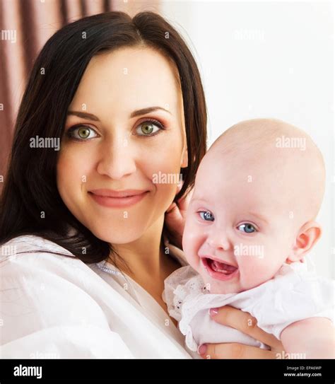 Happy Smiling Mother With Six Month Old Baby Girl Stock Photo Alamy