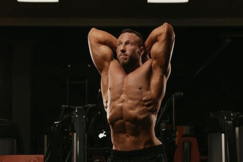 Premium Photo A Bodybuilder With A Beard Is Doing A Stomach Vacuum