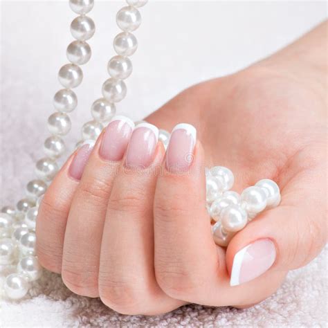 Beautiful Woman S Nails With French Manicure And Pearls Stock Photo