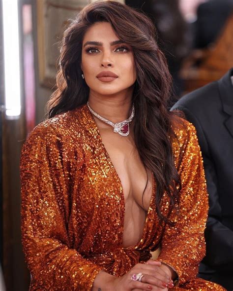 actress priyanka chopra loooks too hot in a plunging neckline gown bulgari event pictures goes