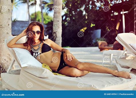 Beautiful Woman In Bikini Relaxing In Chaise Longue Stock Photo Image
