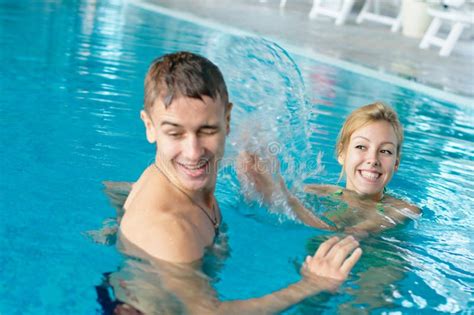 Teen Couple Splashing At The Pool Royalty Free Stock Image Image