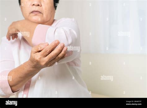Elbow Pain Old Woman Suffering From Elbow Pain At Home Healthcare