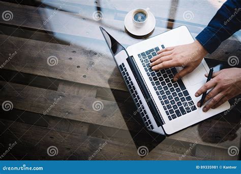 Man Working On Laptop At Sunny Officemale Hand Typing On Keyboard
