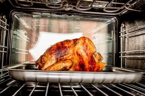 For baking, it is better to take not frozen, but a. Roast chicken in the oven. stock photo. Image of grill ...