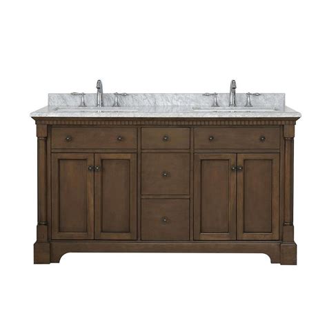 A Double Sink Vanity With Marble Top And Two Faucets On Each Side