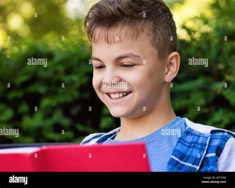 Teen Boy Reading Book Stock Photo Alamy