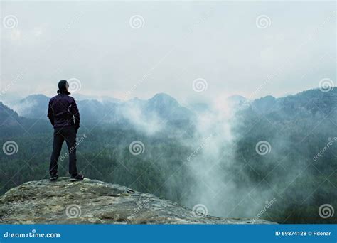 Hiker On Sharp Cliff Of Sandstone Rock In Rock Empires Park And