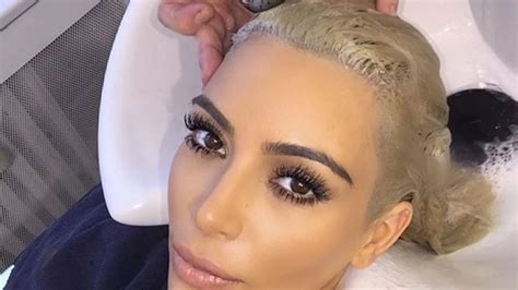 Kim Kardashian Gets Her Platinum Blonde Hair Touched Up While In Paris