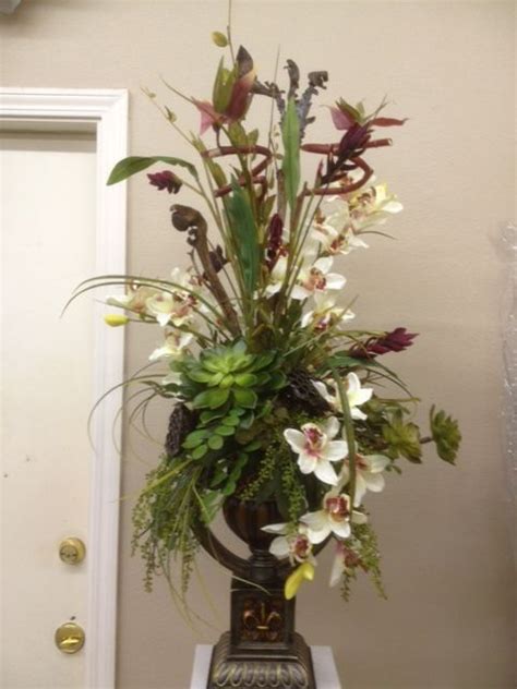 A symbol of pureness and innocence, baby's breath is an inexpensive option to include in your floral arrangements and decor. Orchids (With images) | Flower arrangements, Faux flower ...
