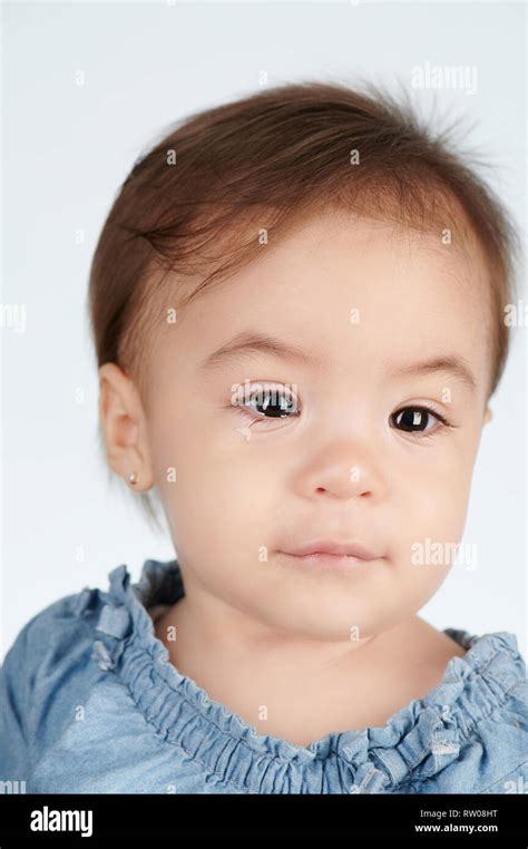 Portrait Of Crying Baby Girl Isolated On White Studio Background Stock