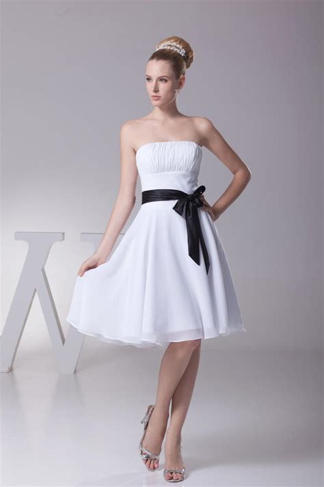 A wedding dress is perhaps the most carefully chosen dress a woman will ever wear. Classic Short Strapless White And Black Short Bridesmaid ...