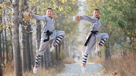 Chinese Martial Arts Students Perform Kung Fu Moves To Speed Up