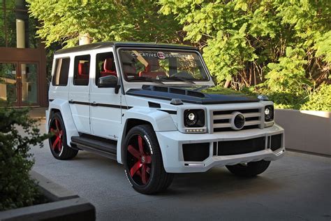 White Mercedes G Class Customized And Put On Red 5 Spoke Custom Rims Mercedes G Class G Wagon