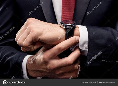 Businessman Checking Wristwatch — Stock Photo © Dmitrypoch 133222052