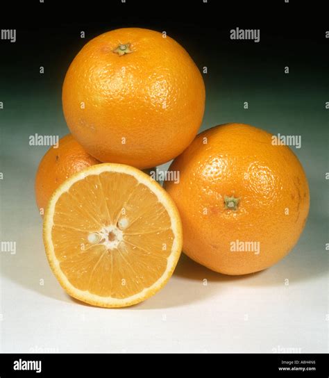A Group Of Whole And Sectioned Orange Fruit Variety Trovita Stock Photo