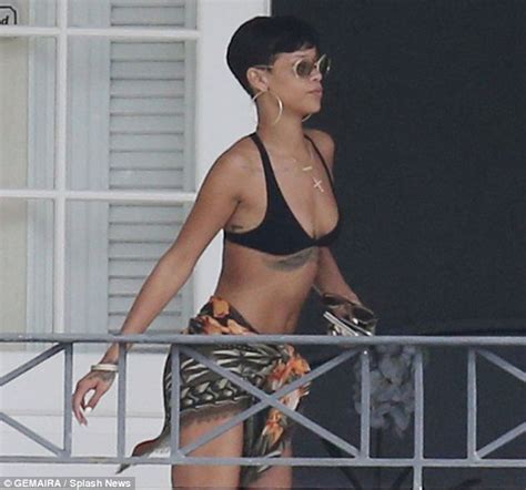 Rihanna Keeps Watch With Binoculars As She Relaxes At Barbados Villa After Attempted Intrusion