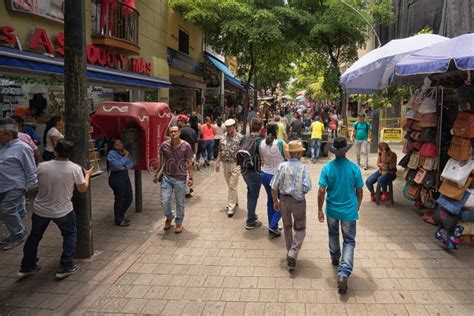 People Walking On The Street In The City Center In Medellin Colombia