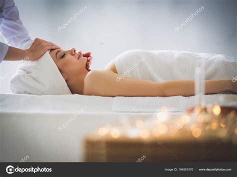 Young Woman Lying On A Massage Tablerelaxing With Eyes Closed Woman
