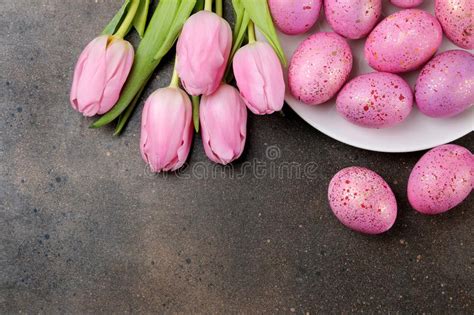 Easter Pink Easter Eggs And Flowers Tulips On A Dark Background Happy
