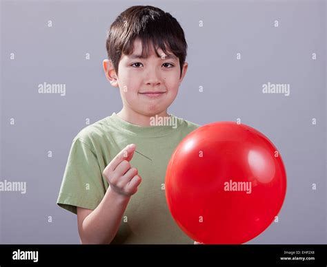 Boy With Pin And Balloon Stock Photo Alamy