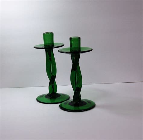pair of emerald green hand blown glass candle holders with twisted stem