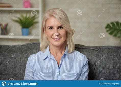 Lovely Middle Aged Blond Woman With A Beaming Smile Stock Photo Image