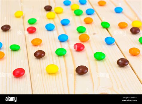 Sweet Bonbons Candy On Woody Background Stock Photo Alamy