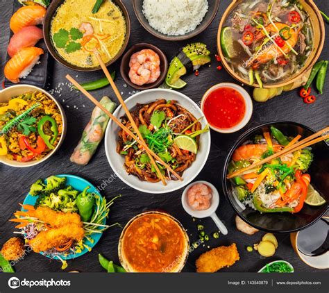Asian thai thai and chinese cuisine, located at appleton, wi. Asian food served on black stone, top view — Stock Photo ...