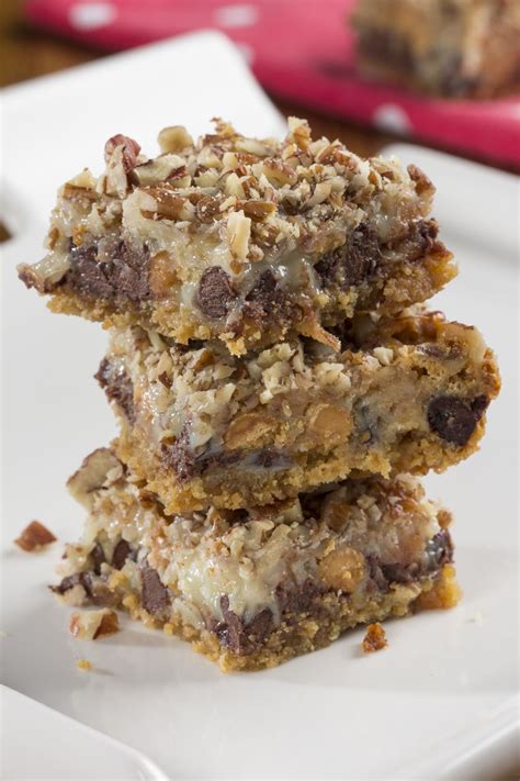 Seven layer bars, magic cookie bars, kitchen sink bars, whatever you call them, this classic dessert is easy and delicious. Sinful Seven Layer Cookies | MrFood.com | Quick dessert ...