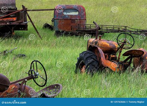 Old Rusted Tractors In Field Green Grass Stock Photo Image Of
