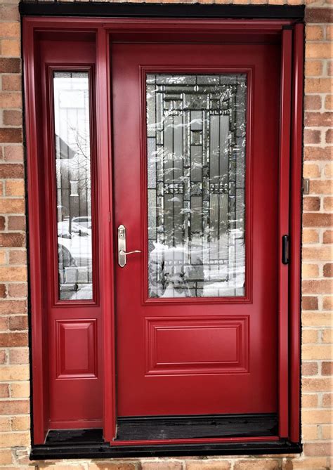 Perfect for true design lovers, they make a bold, contemporary statement. steel door system t240 red with naples glass and retractable screen - Oakville Windows and Doors