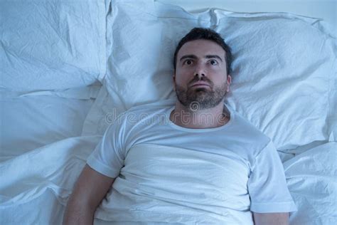 Thoughtful Man Trying To Sleep In His Bed At Night Stock Photo Image