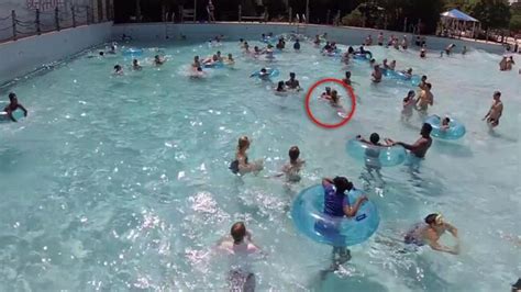 Lifeguard Saves Drowning Girl In Crowded Swimming Pool