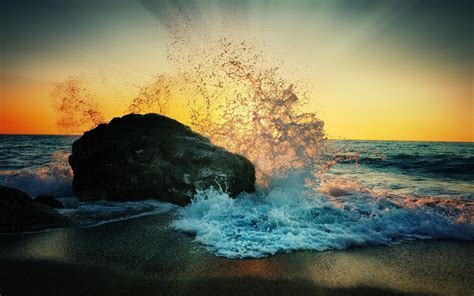 Ocean Waves Splashing Against Rock