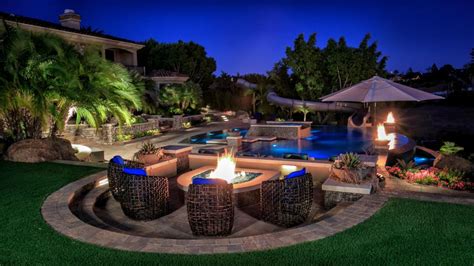 Tropical Pool Oasis With Water Features And Fire Pit Hgtv Ultimate