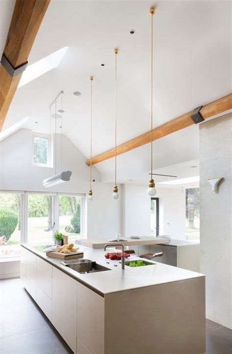 Gorgeous vaulted ceilings provide a sense of luxury and open the home to sun, while exposed beams have a warming effect on the room as a whole. vaulted ceiling lighting ideas skylights mini pendant ...