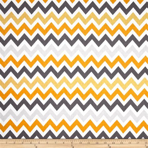 An Orange And Grey Zigzag Pattern On White Fabric With A Ruler