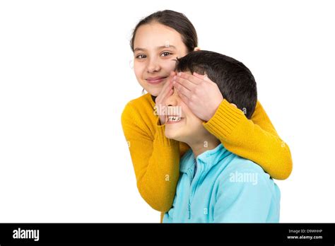 Girl Covering Boys Eyes Isolated In White Stock Photo Alamy